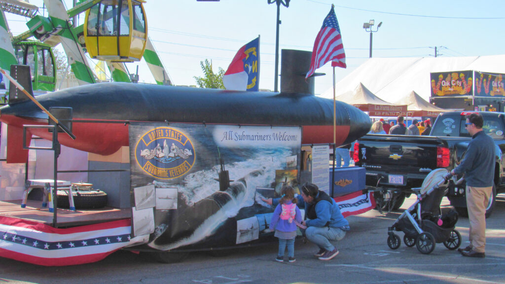 Visitors young and old come to see our submarine float.