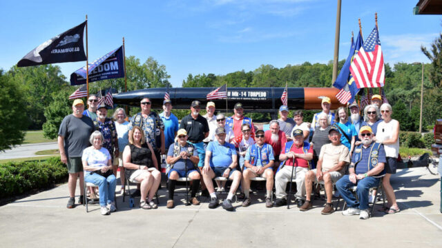 Attendees at the USSVI Nat Greene Base Annual Picnic Base members and guests at the USSVI Nat Greene Base picnic in front of the Torpedo Float
